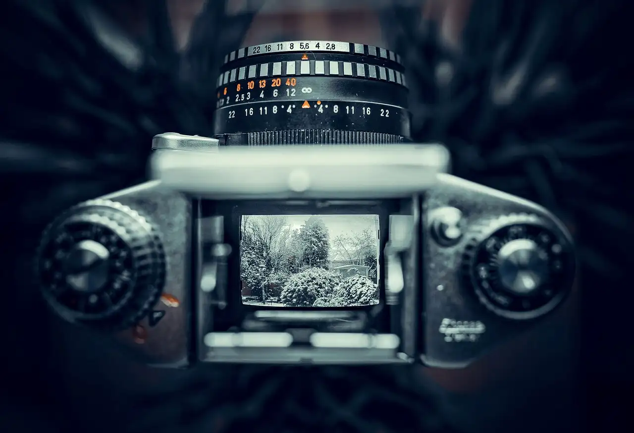Wat was het belang van de eerste draagbare camera?